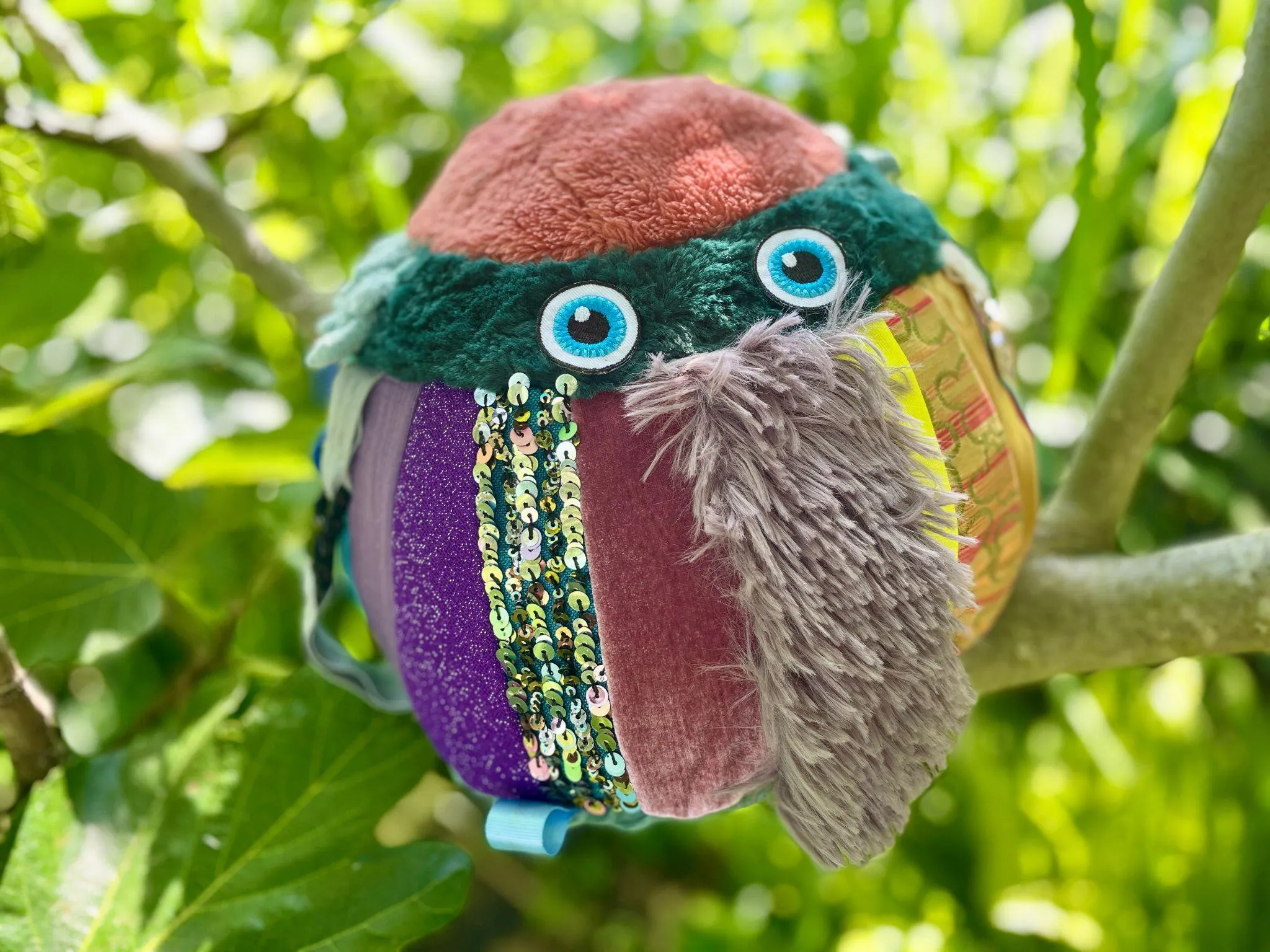 Dotty the puppet sitting in a tree