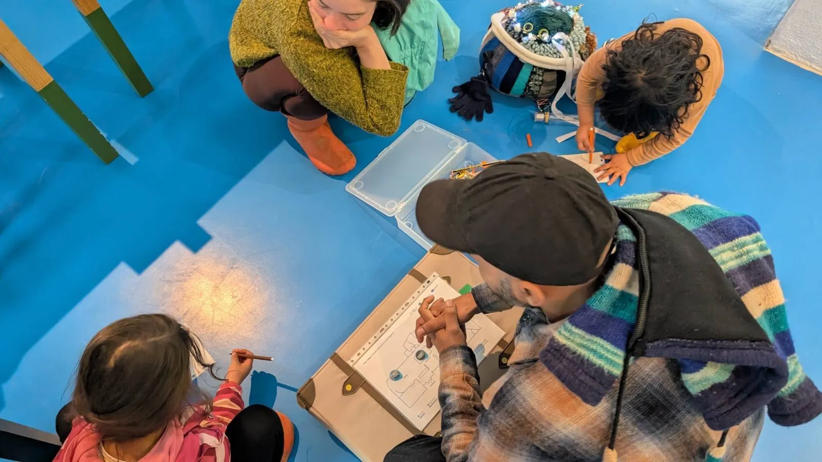 Overhead view of children taking part in a workshop
